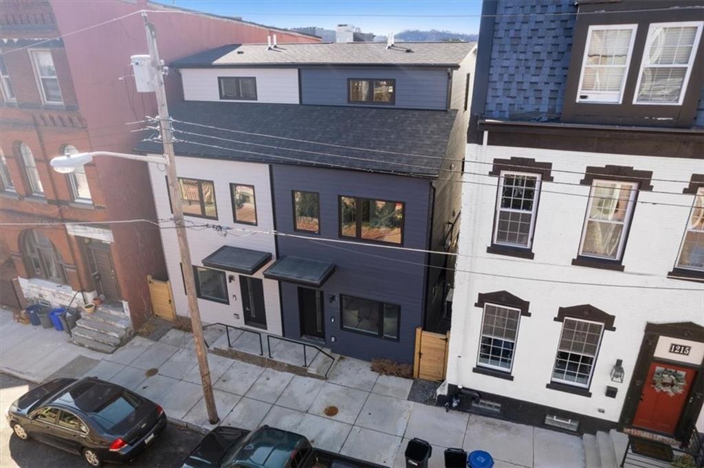 1213 Boyle Street Pittsburgh, PA 15212 - Photo 25 of 31 a front view of a building with many windows