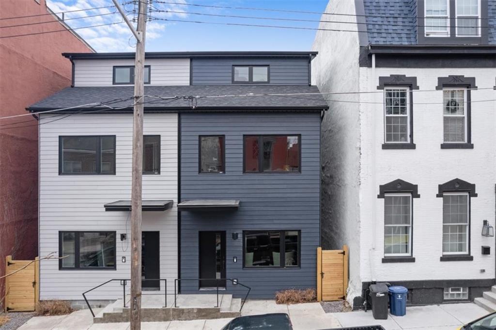 1213 Boyle Street Pittsburgh, PA 15212 - Photo 30 of 31 a front view of a building with glass windows
