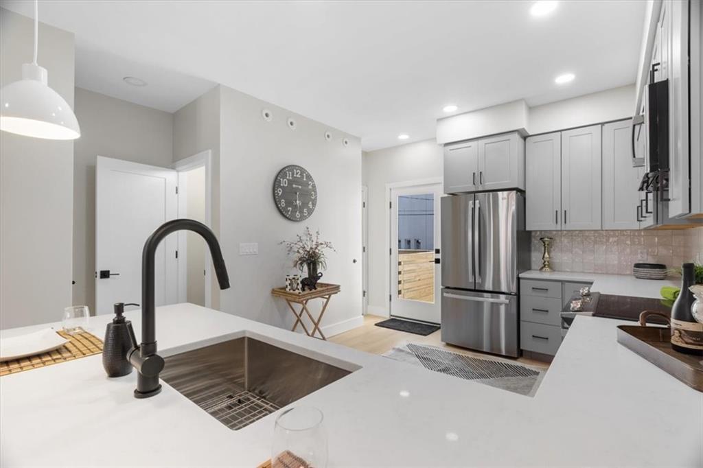 1213 Boyle Street Pittsburgh, PA 15212 - Photo 8 of 31 a kitchen with a refrigerator a stove and a sink
