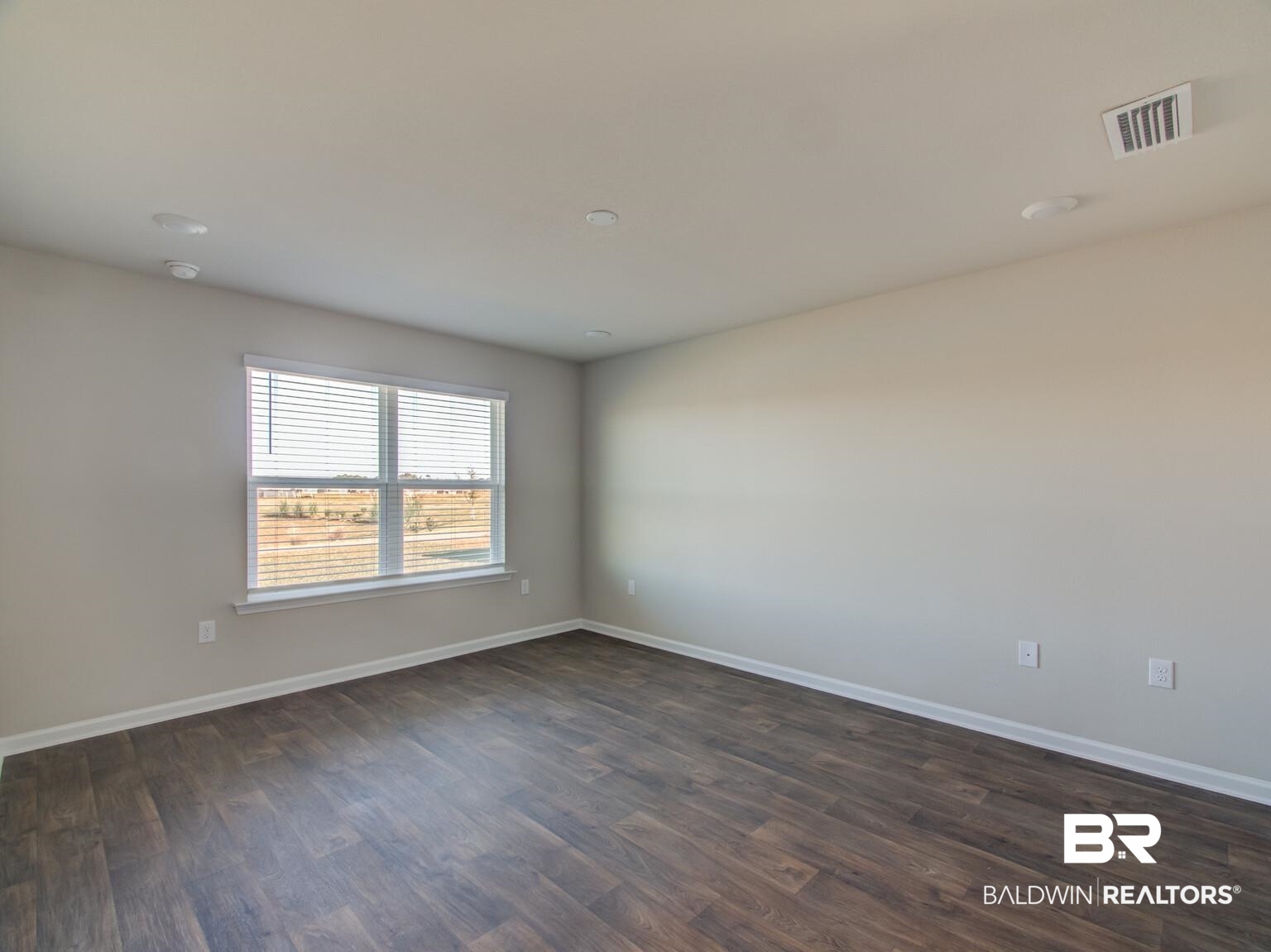 23952 Citation Loop Daphne, AL 36526 - Photo 22 of 69 Spare room featuring baseboards and dark wood-type flooring