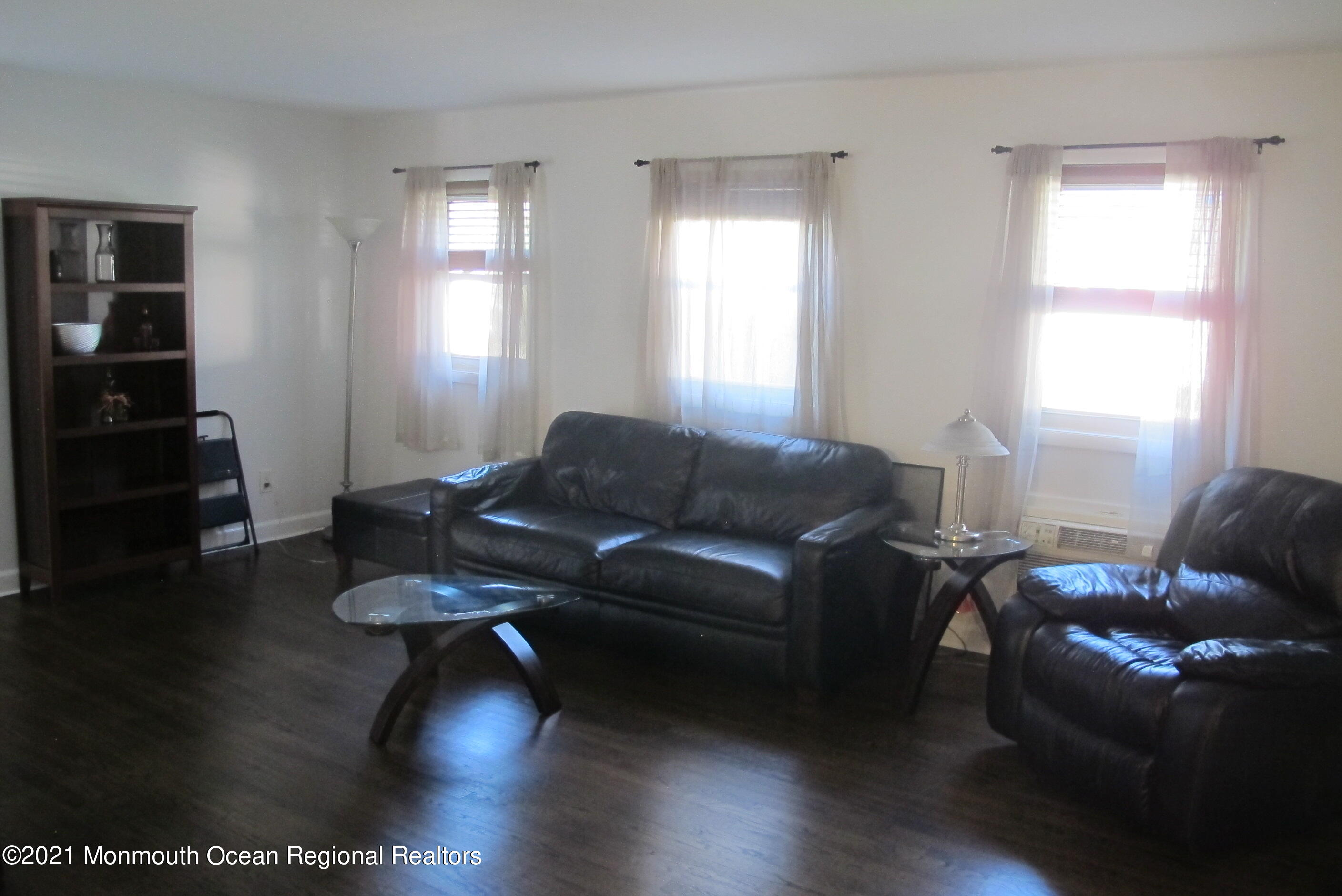 601 Mistletoe Avenue, Unit 14 Point Pleasant, NJ 08742 - Photo 3 of 8 a living room with furniture and wooden floor