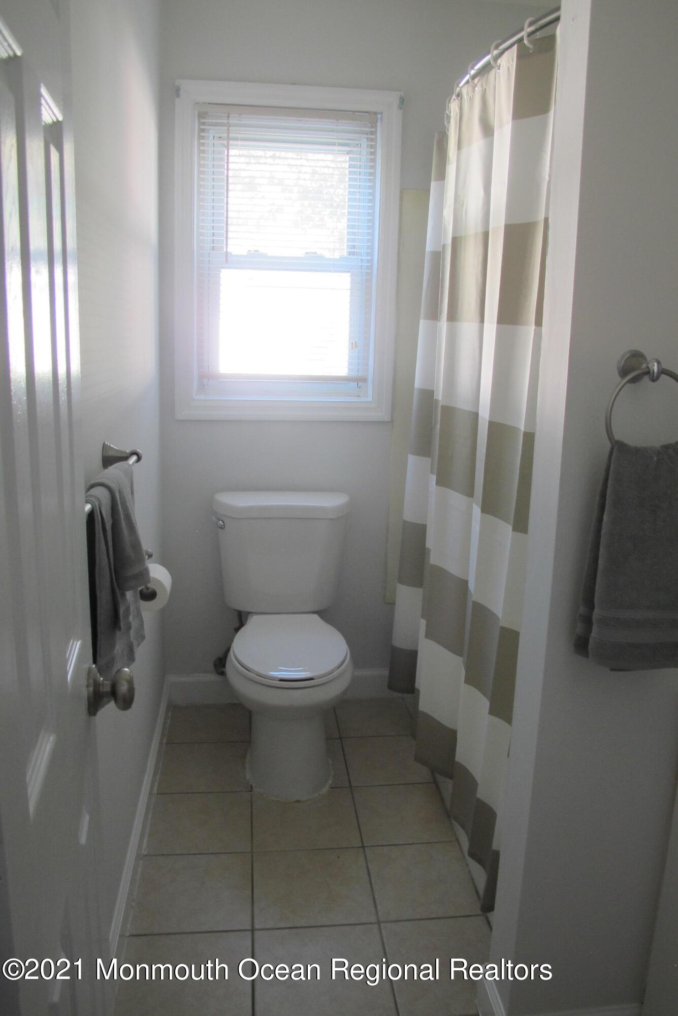 601 Mistletoe Avenue, Unit 14 Point Pleasant, NJ 08742 - Photo 4 of 8 a bathroom with a toilet and a shower