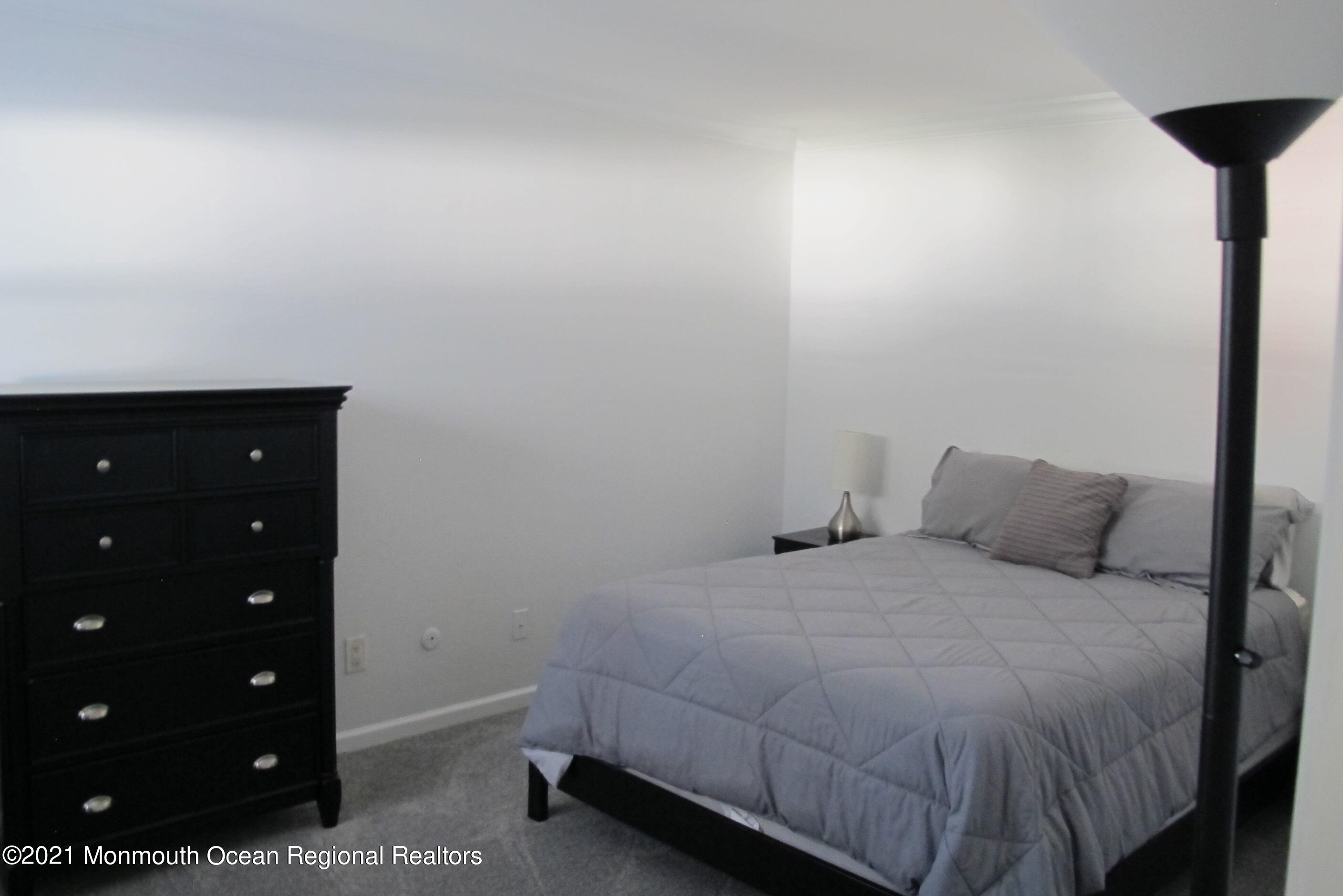 601 Mistletoe Avenue, Unit 14 Point Pleasant, NJ 08742 - Photo 5 of 8 a bedroom with a bed and a closet