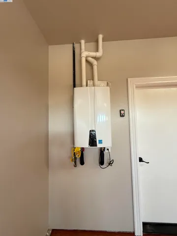 a view of a room with wooden floor and staircase