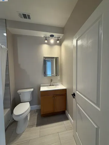 a bathroom with a tub and a shower