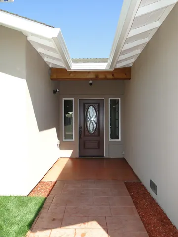 a view of an entryway with a floor to ceiling window
