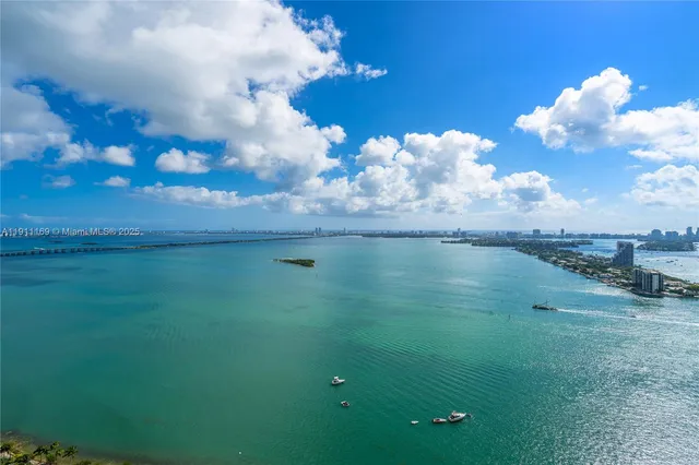 a view of a lake in between of building