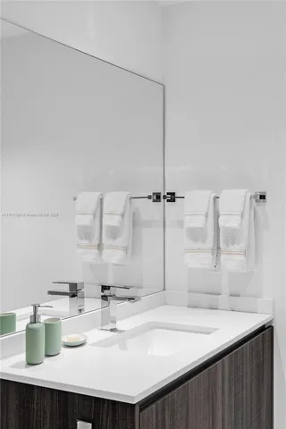 a view of a storage and utility room with washer and dryer