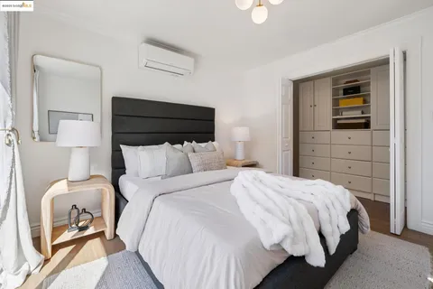 a bedroom with a bed and a cabinets