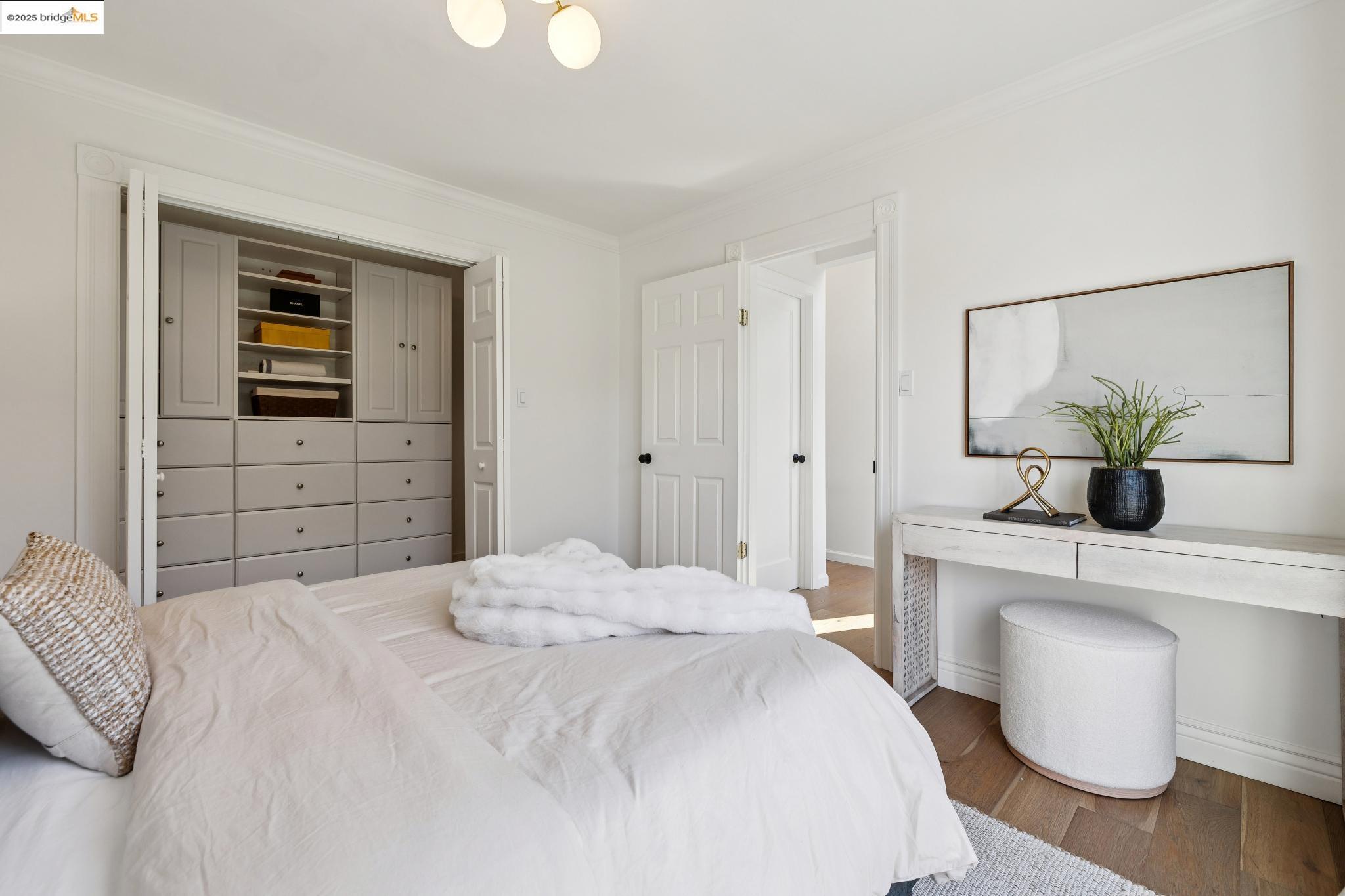 1642 Tenth Street Berkeley, CA 94710 - Photo 15 of 51 a bedroom with a bed and a dresser