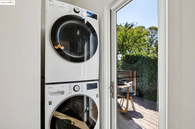a view of a hallway with washer and dryer