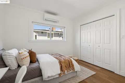 a bedroom with bed and a window