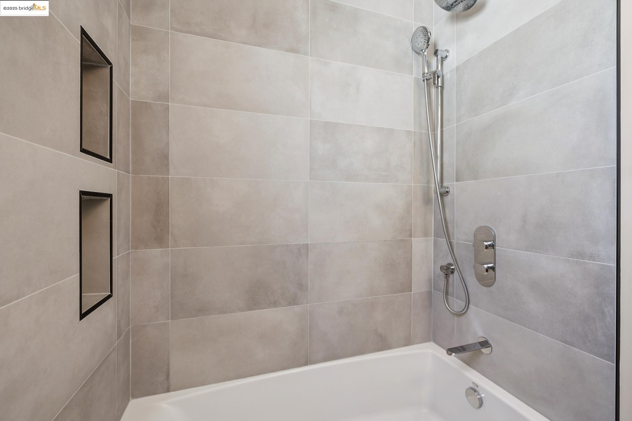 1642 Tenth Street Berkeley, CA 94710 - Photo 26 of 51 a bathroom with a bathtub and shower