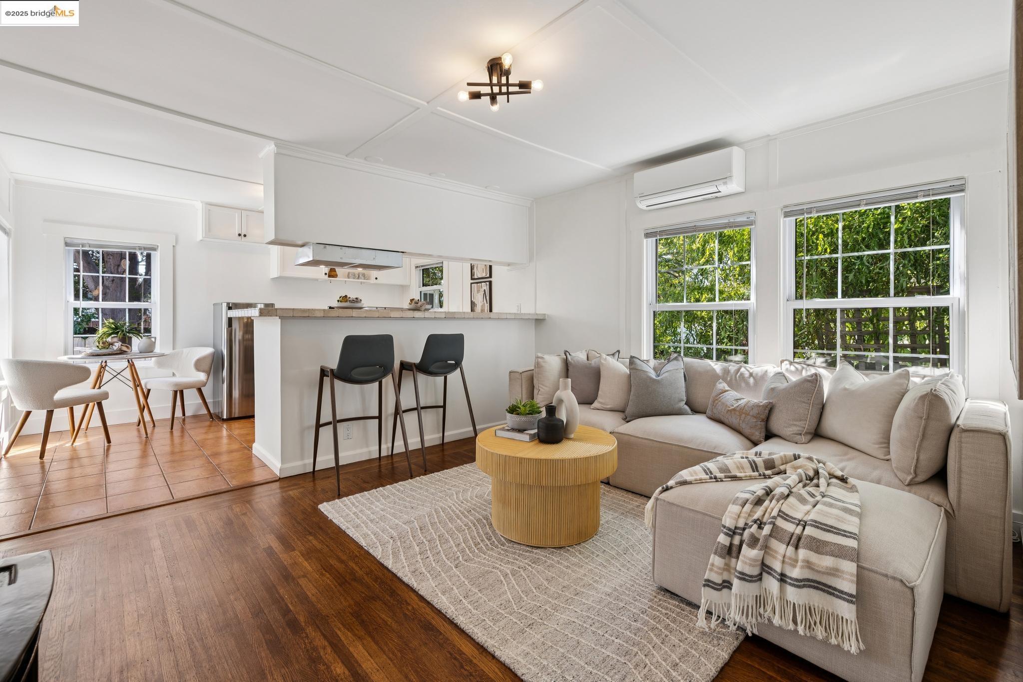 1642 Tenth Street Berkeley, CA 94710 - Photo 28 of 51 a living room with furniture and a large window