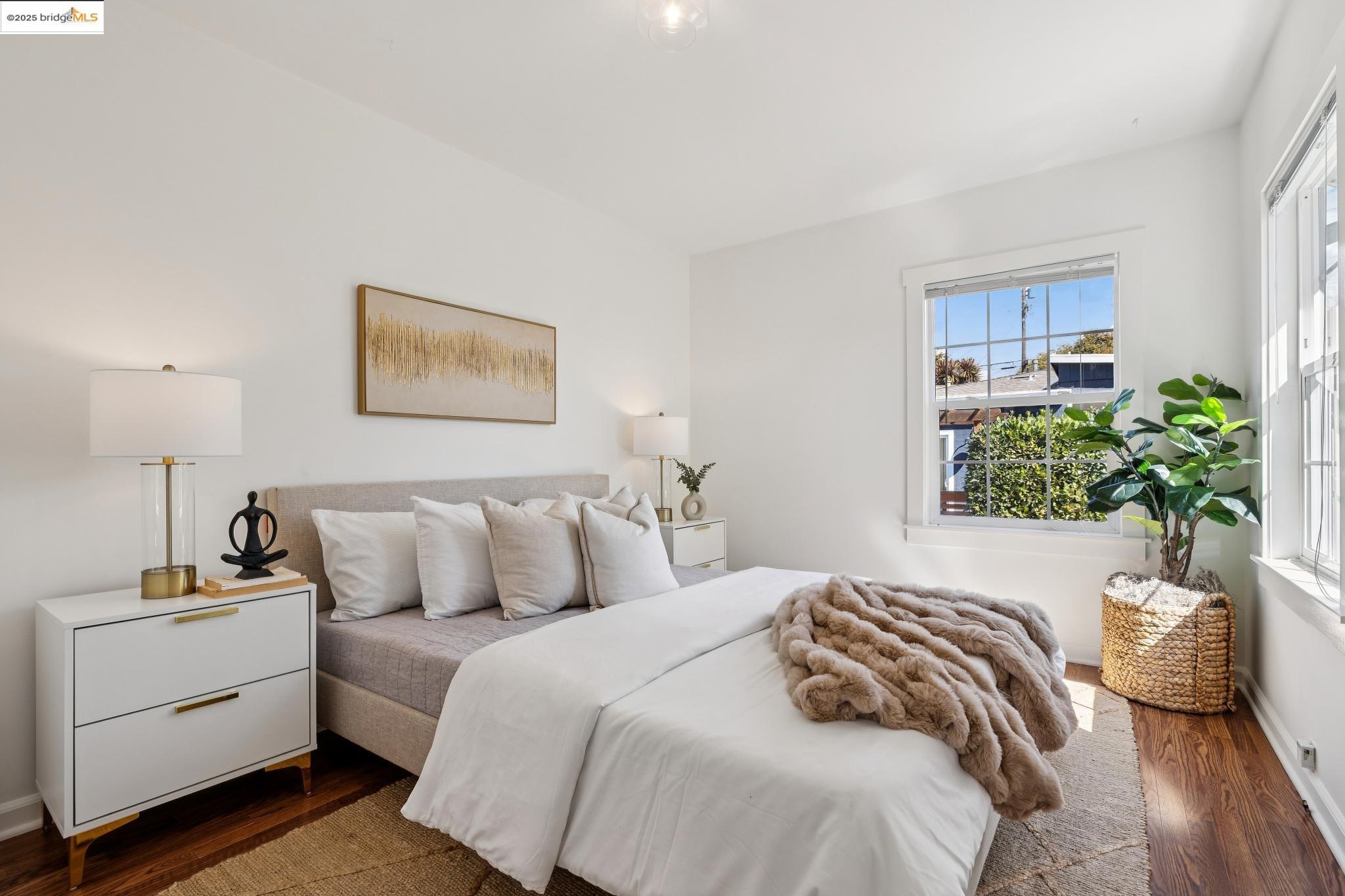 1642 Tenth Street Berkeley, CA 94710 - Photo 33 of 51 a bedroom with a bed and a painting on the wall