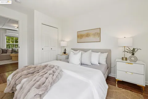 a bedroom with a bed and a couch