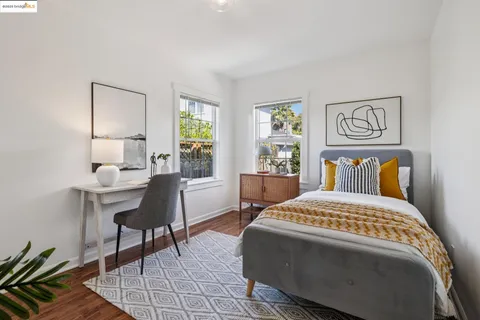 a bedroom with a bed and a table in it