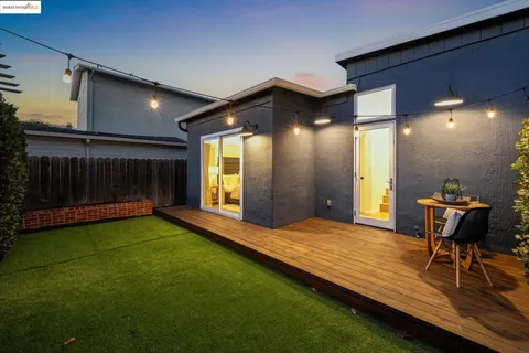 a view of an empty room with a fireplace and a yard