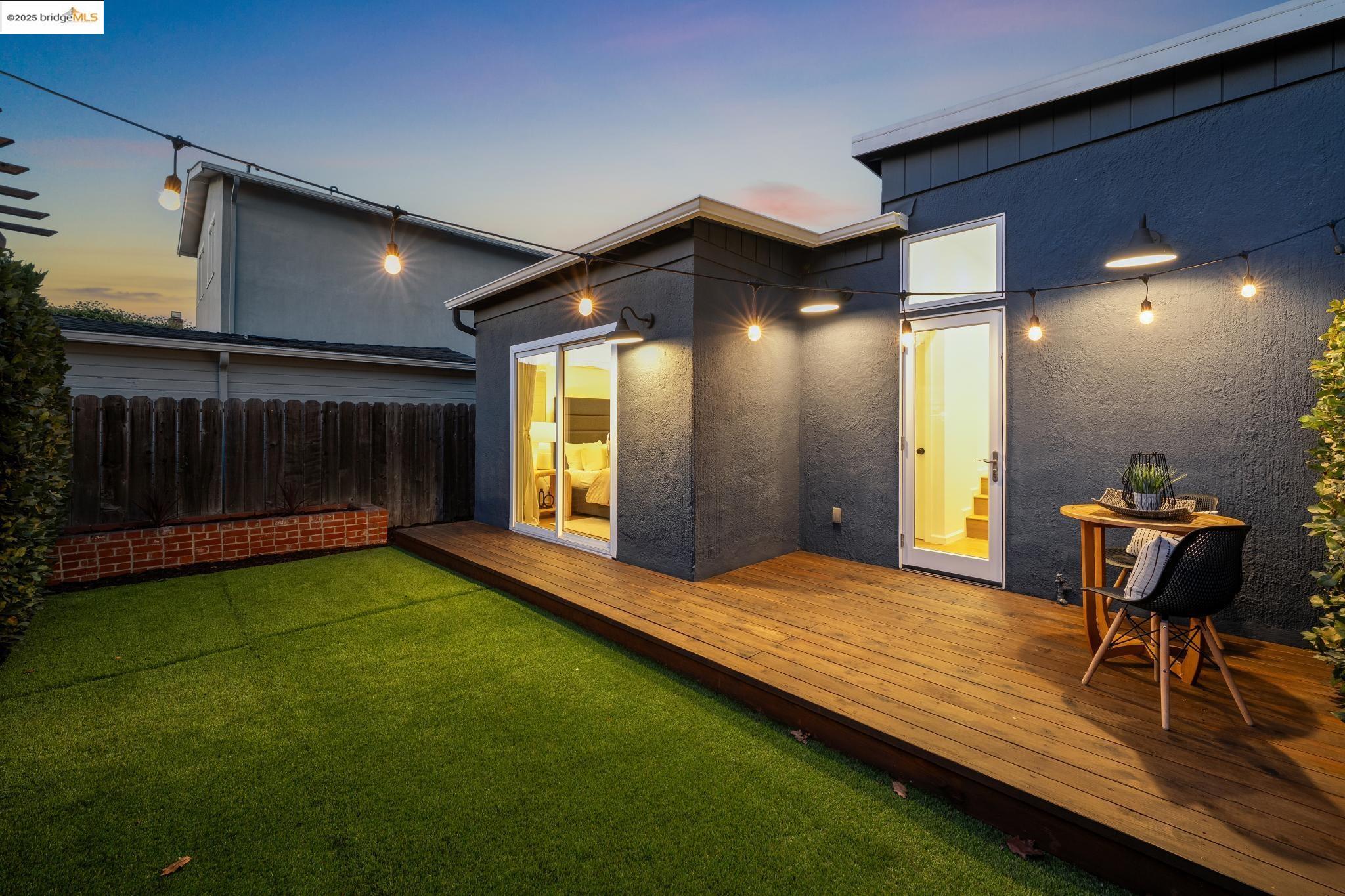 1642 Tenth Street Berkeley, CA 94710 - Photo 46 of 51 a view of an empty room with a fireplace and a yard