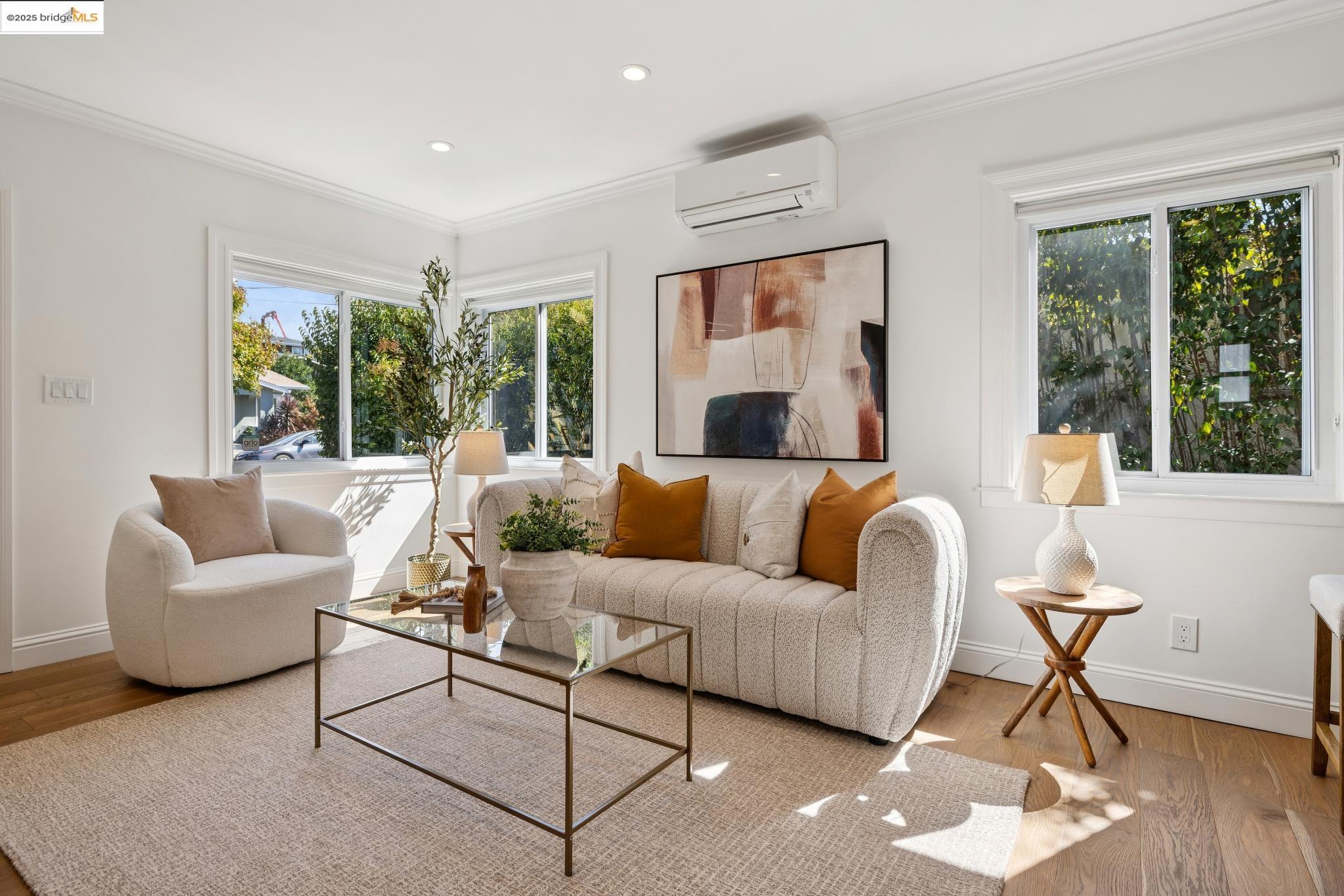1642 Tenth Street Berkeley, CA 94710 - Photo 7 of 51 a living room with furniture and a large window