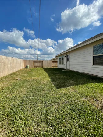 a view of a backyard of the house