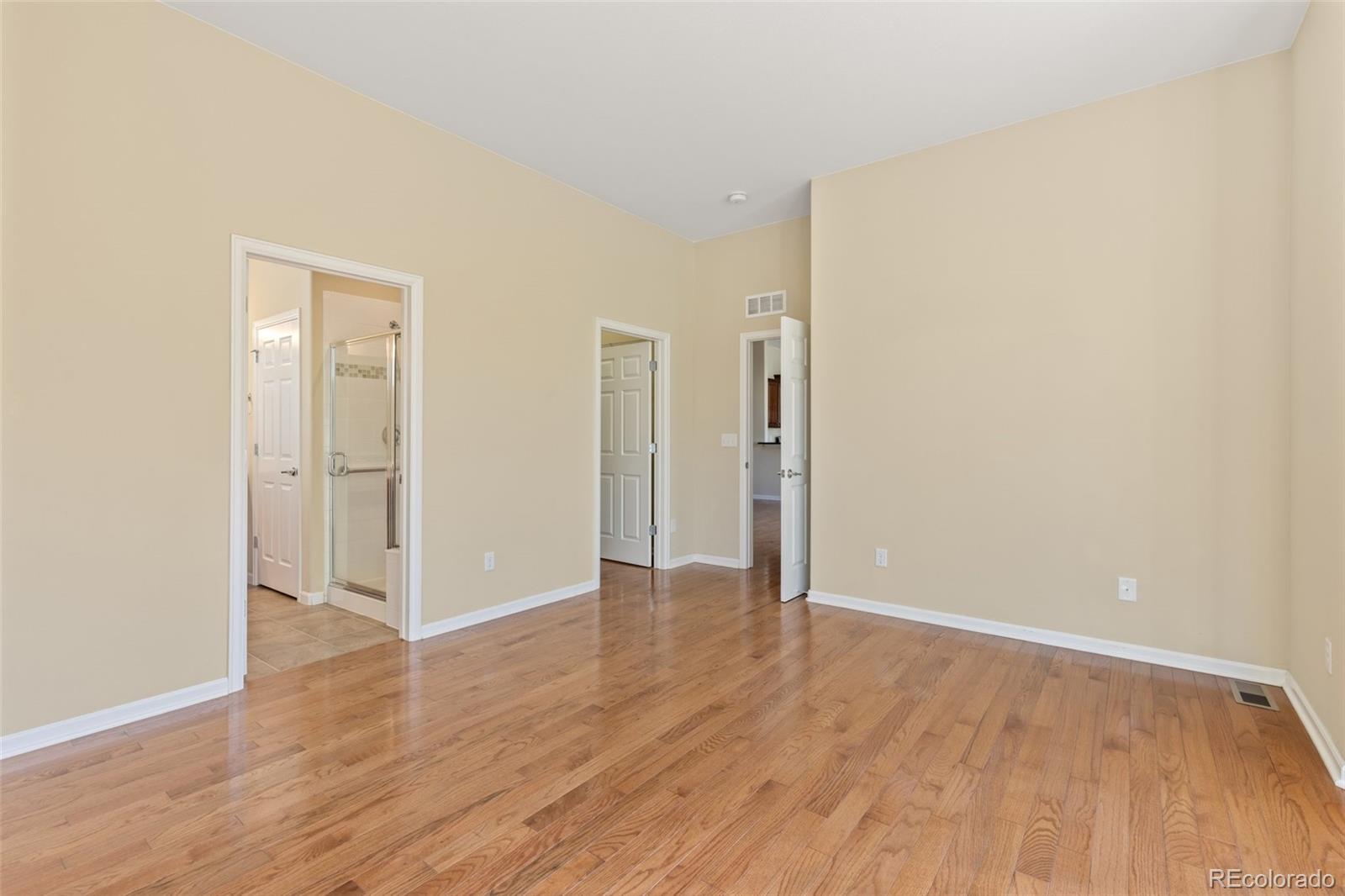 15965 Redcloud Way Broomfield, CO 80023 - Photo 17 of 49 wooden floor in an empty room