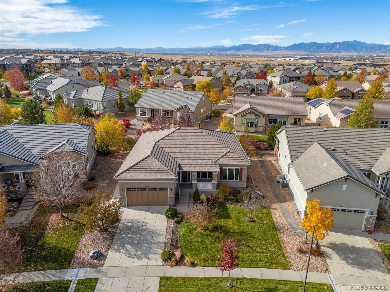15965 Redcloud Way Broomfield, CO 80023 - Photo 2 of 49 an aerial view of a house with a lake view