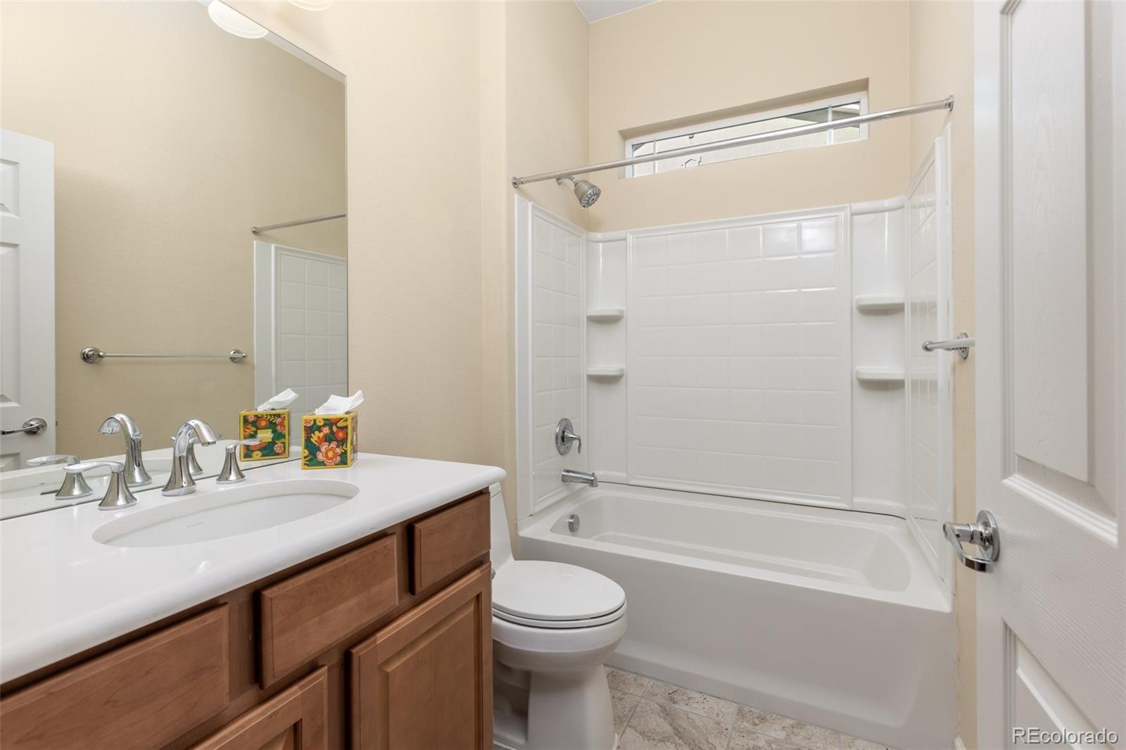 15965 Redcloud Way Broomfield, CO 80023 - Photo 25 of 49 a bathroom with a sink a toilet and a bathtub