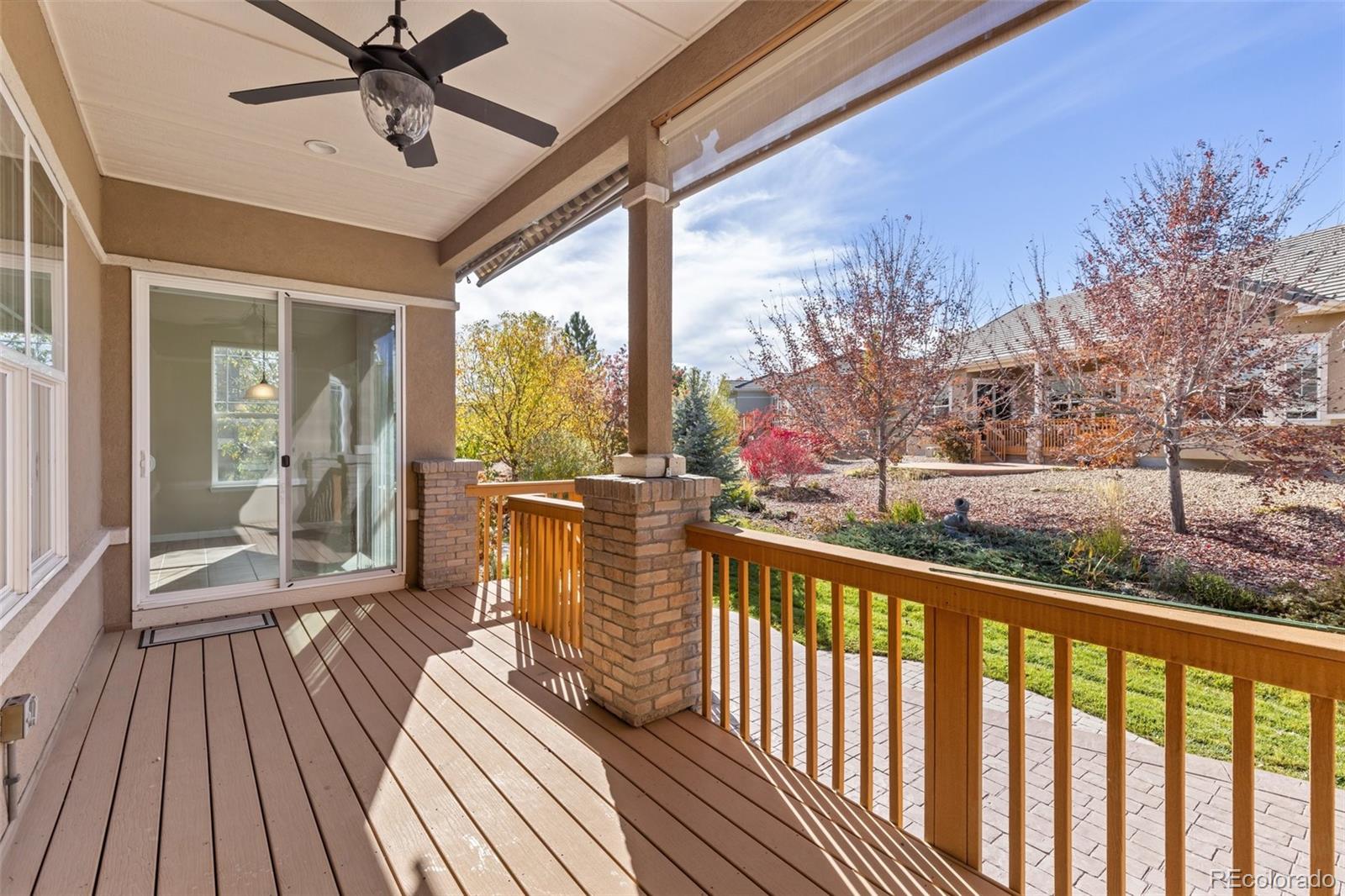 15965 Redcloud Way Broomfield, CO 80023 - Photo 33 of 49 a view of a porch with wooden floor and outdoor space