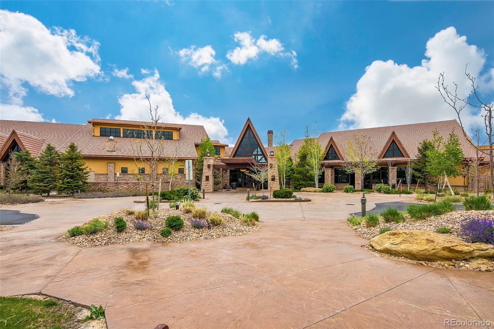 15965 Redcloud Way Broomfield, CO 80023 - Photo 37 of 49 a front view of a house with a yard and garage