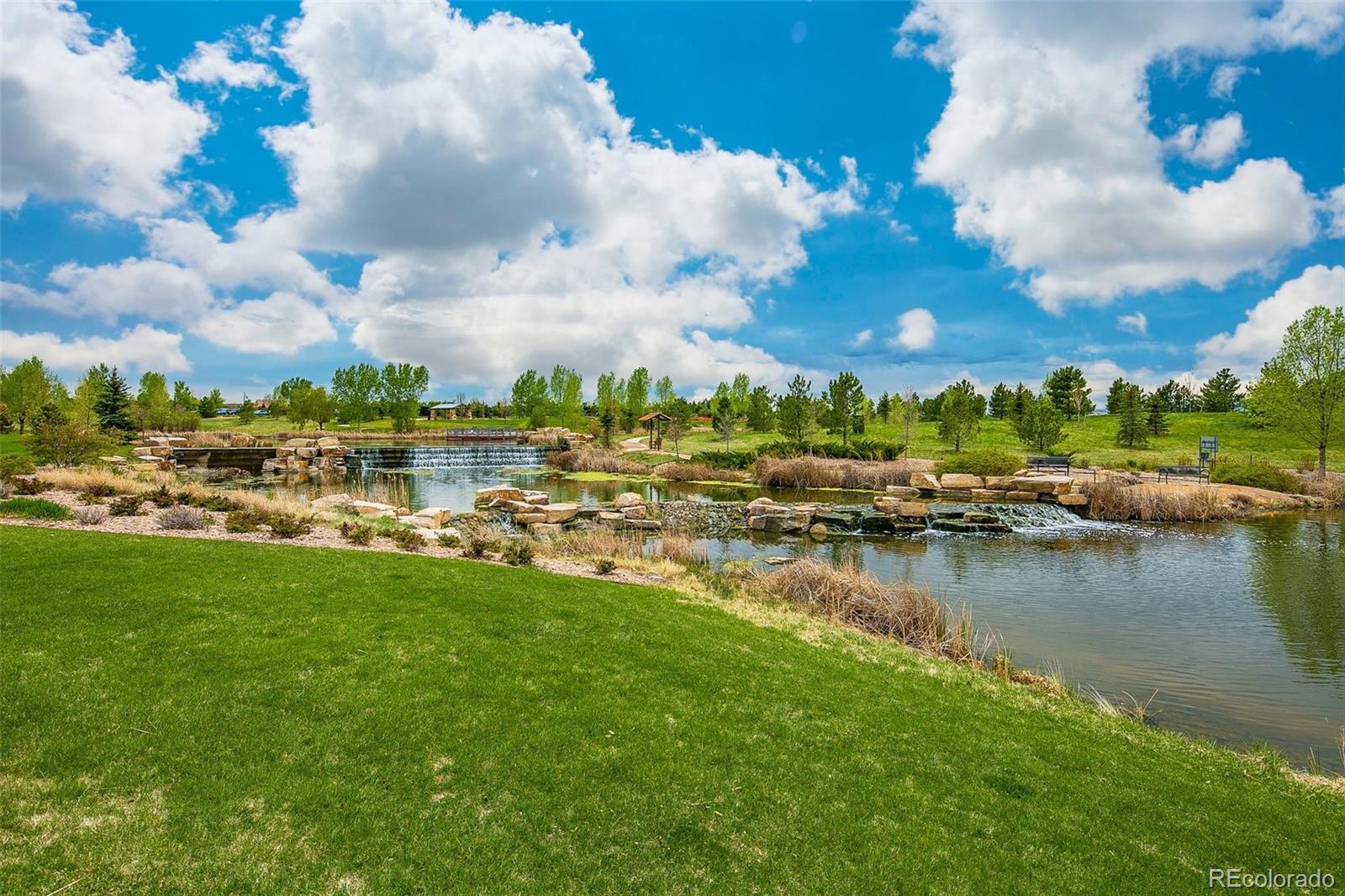 15965 Redcloud Way Broomfield, CO 80023 - Photo 42 of 49 a view of a lake with houses