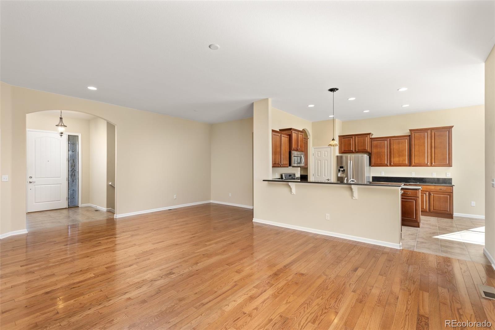 15965 Redcloud Way Broomfield, CO 80023 - Photo 10 of 49 a view of kitchen with kitchen island and stainless steel appliances