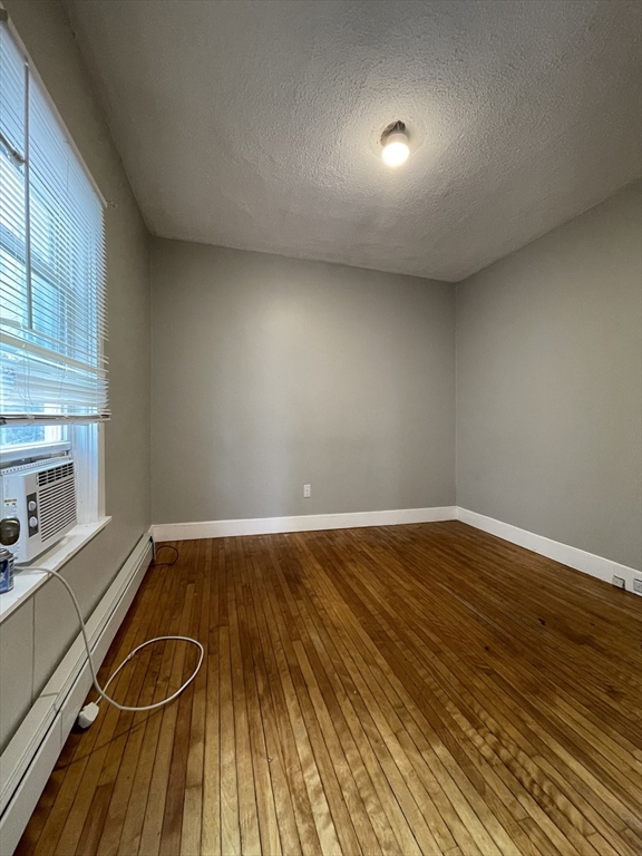 5 Freeland Terrace, Unit 1 Worcester, MA 01603 - Photo 14 of 16 a view of a room with wooden floor and sink