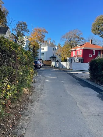 a view of a street with cars on road
