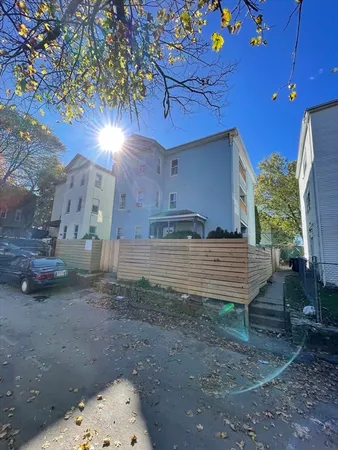 a view of a backyard with plants and a patio