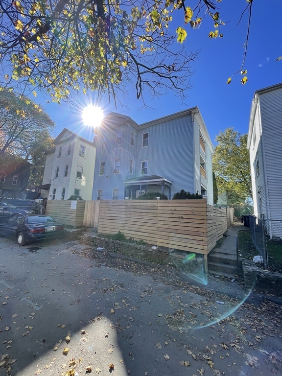5 Freeland Terrace, Unit 1 Worcester, MA 01603 - Photo 3 of 16 a view of a backyard with plants and a patio