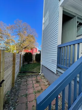 a view of a backyard with pathway