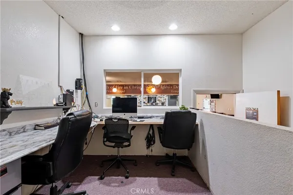 a work room with furniture and window