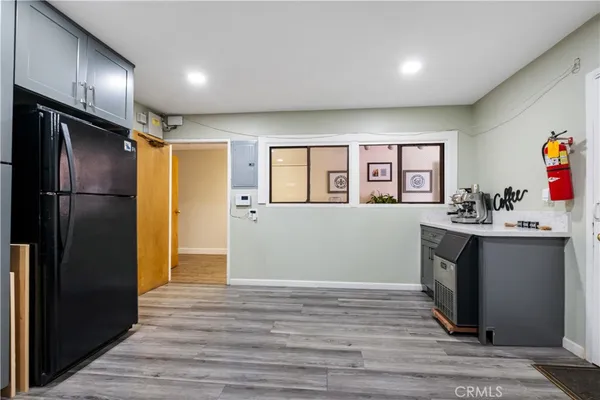 a view of a kitchen from the hallway