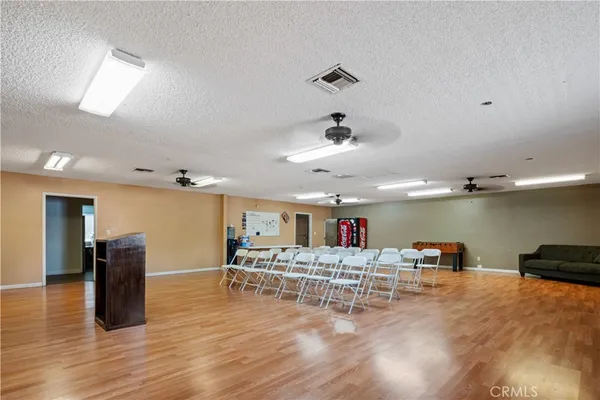 a room with stainless steel appliances kitchen island a refrigerator and a stove