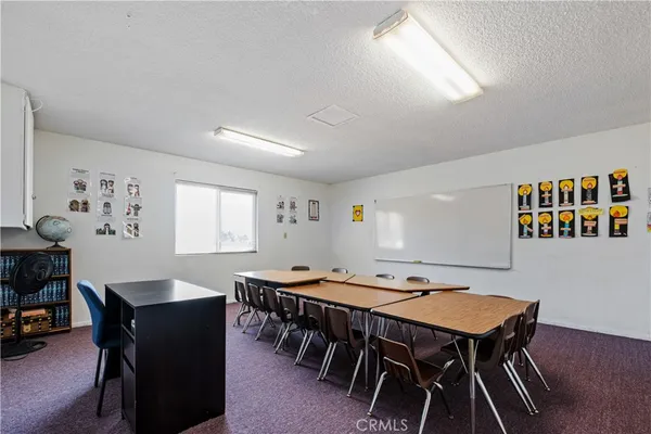 a dining room with a table and chairs