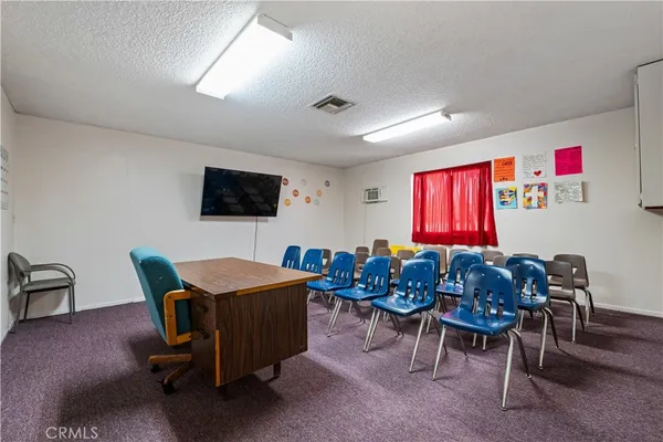 a room with furniture and a flat screen tv