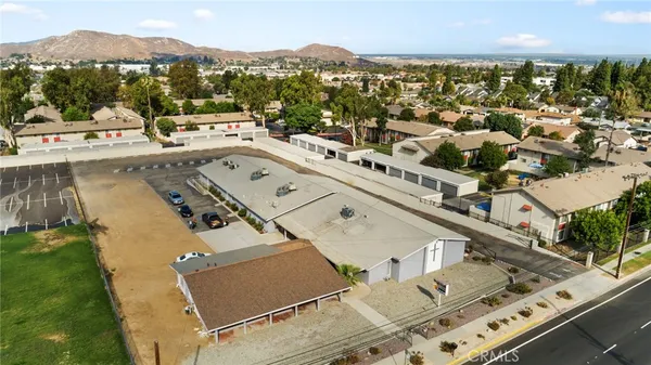 an aerial view of a house with a swimming pool
