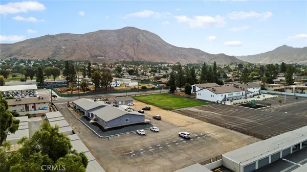 a view of a town with couple of cars parked