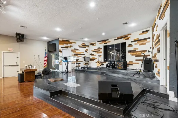 a kitchen with stainless steel appliances granite countertop a refrigerator and a stove