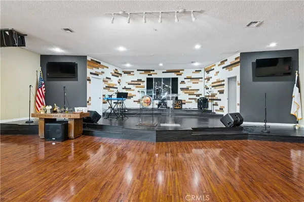 a view of a living room and kitchen floor
