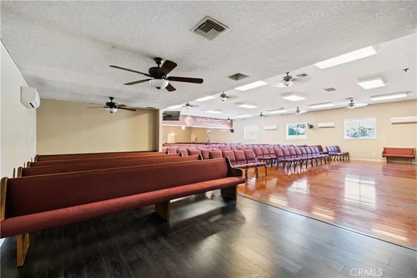 a room with lots of furniture and wooden floor