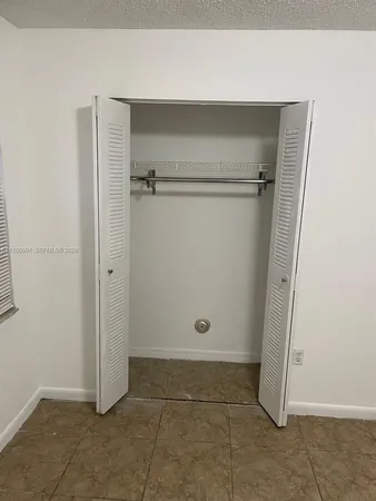 an empty room with wooden door