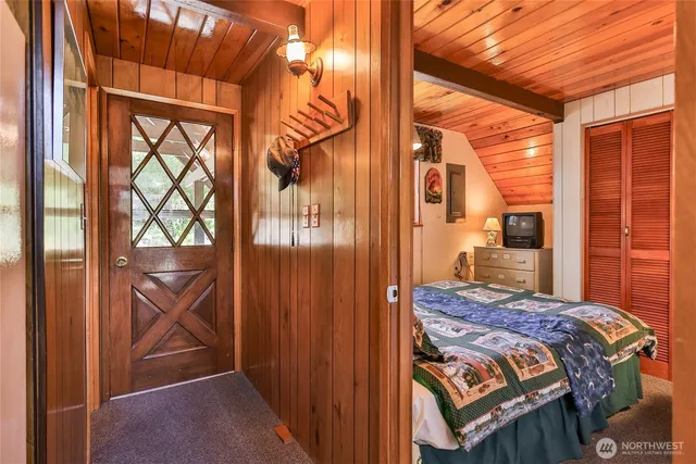 a bedroom with two beds and a large window