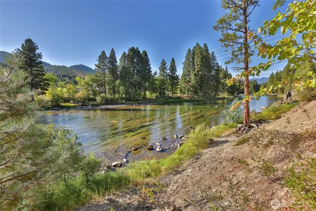 a view of a lake with houses in the back